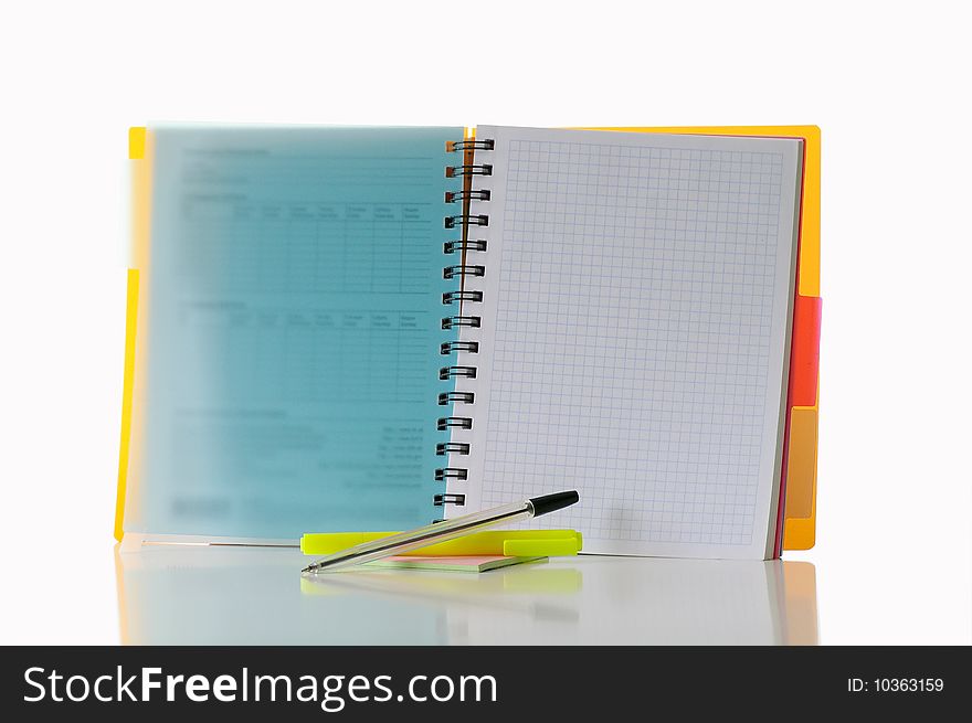 Open notebook with  marker against the white background. Open notebook with  marker against the white background