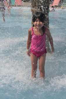 Young Girl Playing In Water Royalty Free Stock Photos