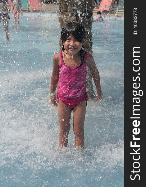 Young girl playing in water