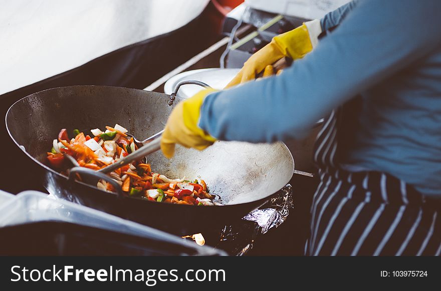 Person Cooking on Stainless Steel Cooking Pot