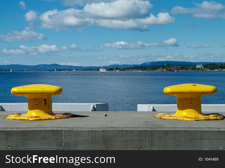 Two yellow cleats with a view over the Oslofjord, Norway