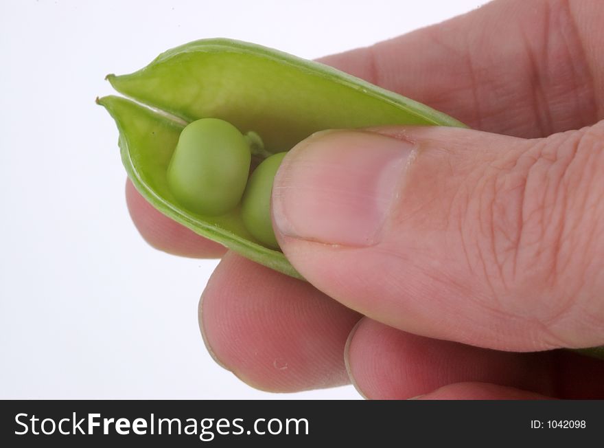 A pea pod being opened