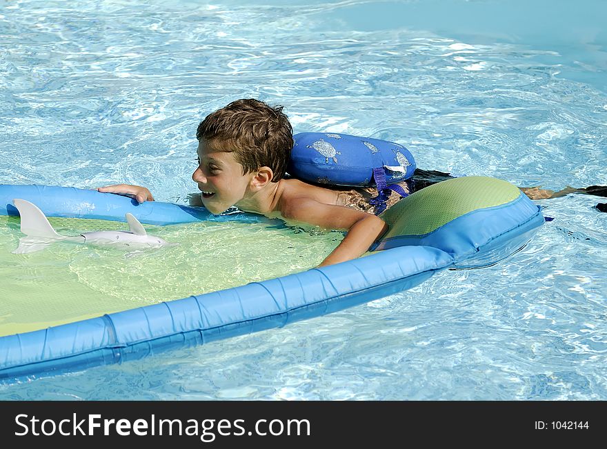 Young Boy in a Pool. Young Boy in a Pool