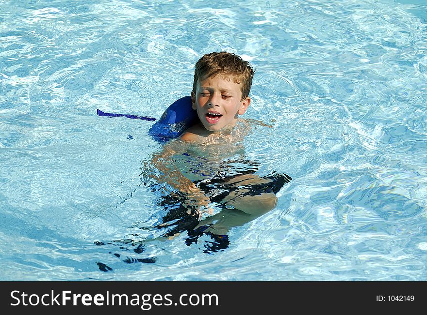 Young Boy in a Pool. Young Boy in a Pool