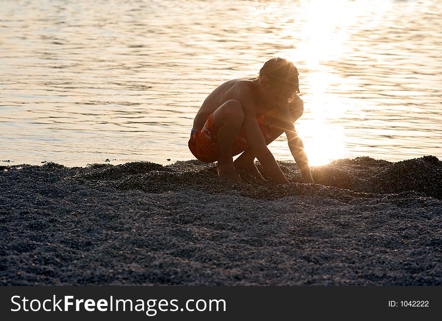 Boy playing in the sand. Boy playing in the sand