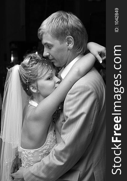 Bride embraces bridegroom. Bride embraces bridegroom