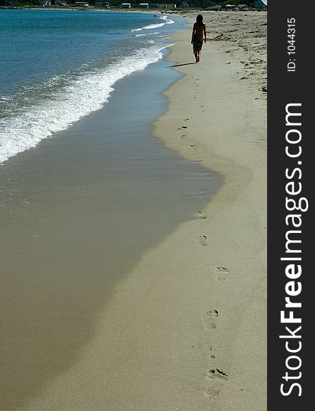 Coast of a beach, foam and traces of the girl. Coast of a beach, foam and traces of the girl