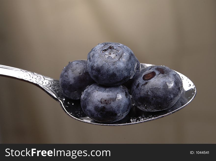 Blueberries on a spoon.