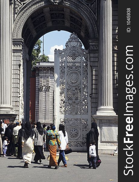 Turkish and foreign tourists entering Dolmabahce palace in Istanbul, Turkey. Turkish and foreign tourists entering Dolmabahce palace in Istanbul, Turkey