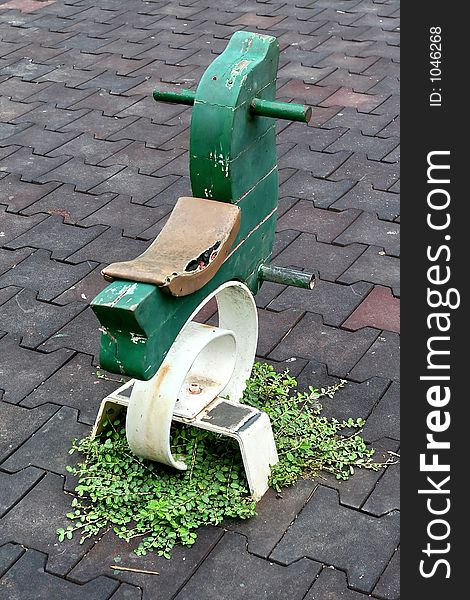 Green Carousel Pony In a public Park