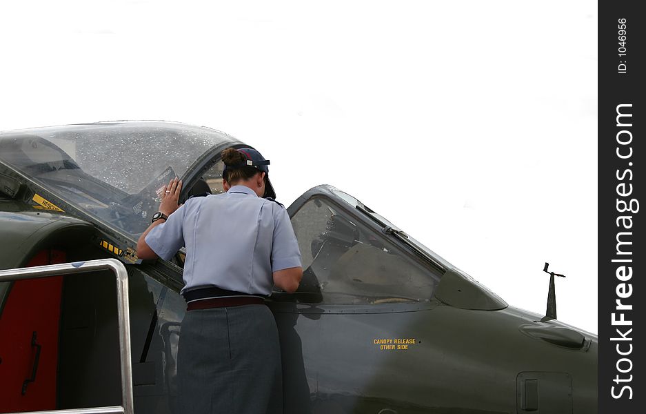 RAF technician checking Harrier cockpit. RAF technician checking Harrier cockpit