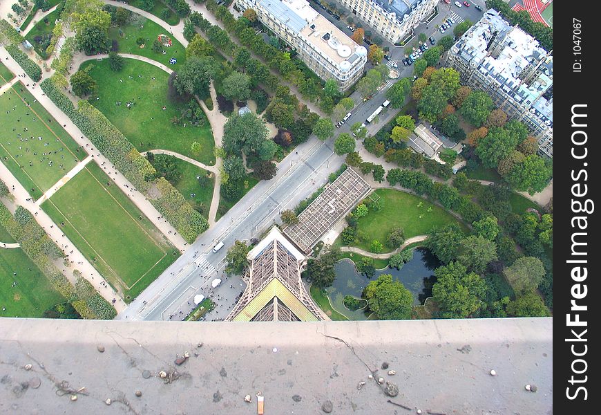 View downwards over the railings from the top viewing platform of the Eiffel Tower. View downwards over the railings from the top viewing platform of the Eiffel Tower.