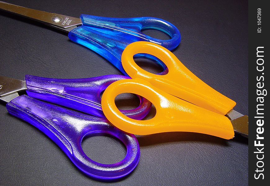 Three colorful scissors. Three colorful scissors