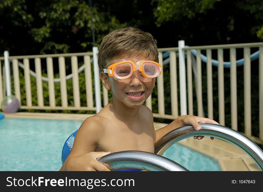 Child in a Swimmng Pool - Summer Fun Concept