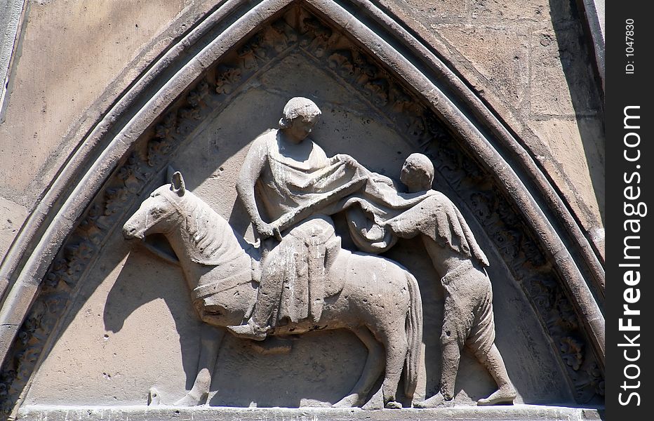 Knight fighting a peasant stone statue