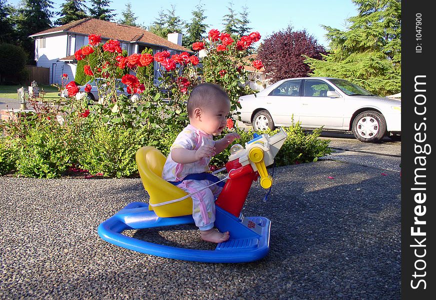 A boy is riding on a bike