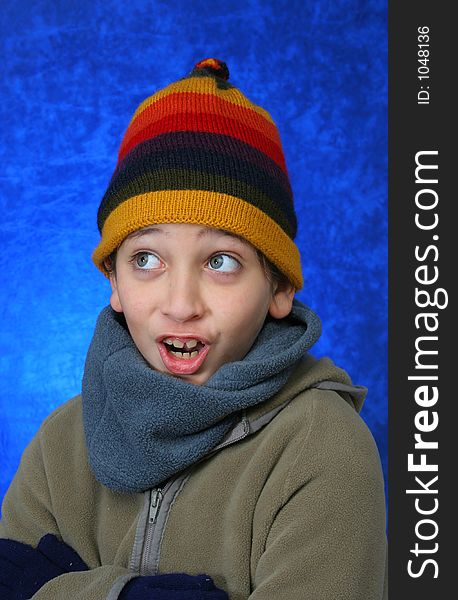 Boy doing fun expression in winter outfit. Look at my gallery for more winter images. Boy doing fun expression in winter outfit. Look at my gallery for more winter images