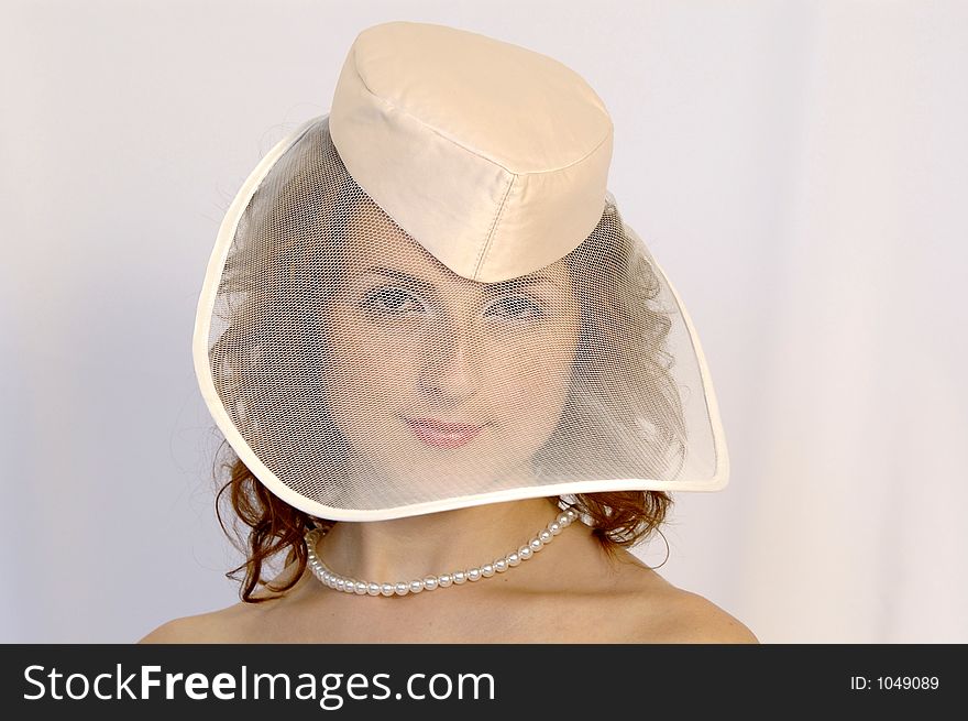 Girl in wedding hat. Girl in wedding hat