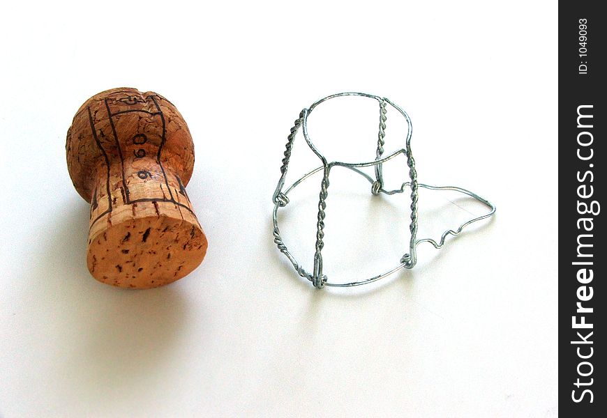 Champagne cork and wire retainer, isolated. Champagne cork and wire retainer, isolated