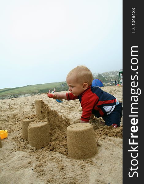 Small child exploring a beach in Cornwall. Small child exploring a beach in Cornwall.