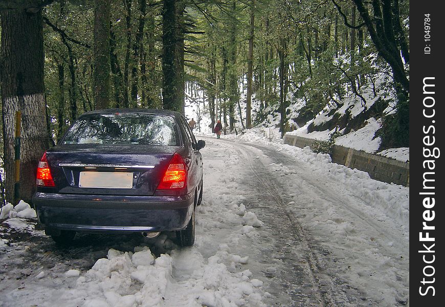 car stuck in slippery snow on steep mountain road. car stuck in slippery snow on steep mountain road