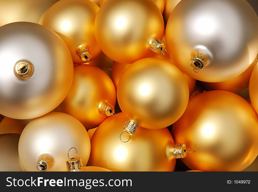 Close-up of golden and white Christmas balls