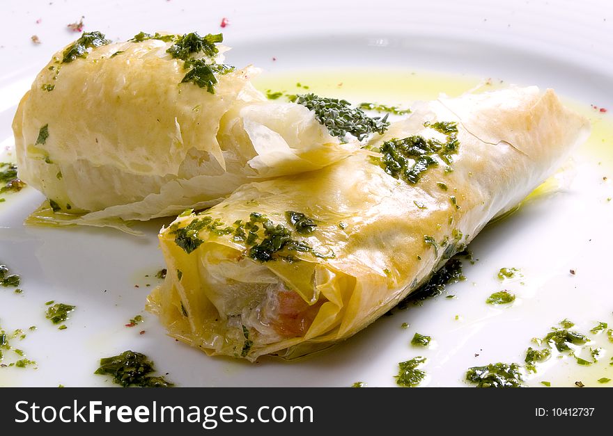 Baked apples in puff pastry on a plate