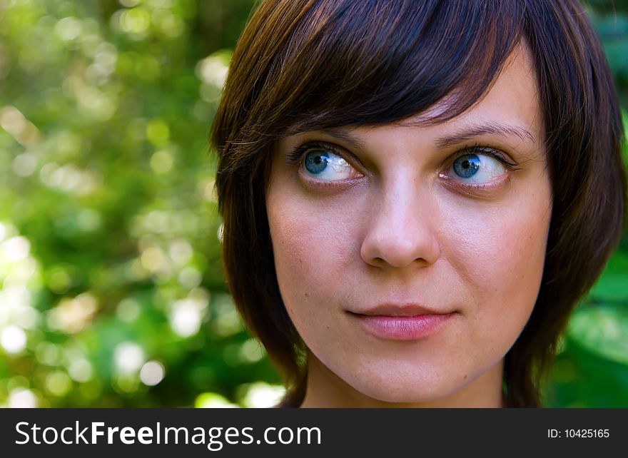 Close-up portrait of young attractive woman looking up. Close-up portrait of young attractive woman looking up