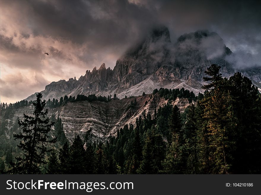 Photo of Mountain With Ice Covered With Black and Gray Cloud