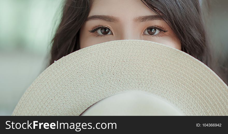 White Hat in Woman&#x27;s Face