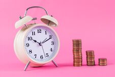 Old Clock And Golden Coins On Pink Background Royalty Free Stock Images Old Clock And Golden Coins On Pink Background Royalty Free Stock Images