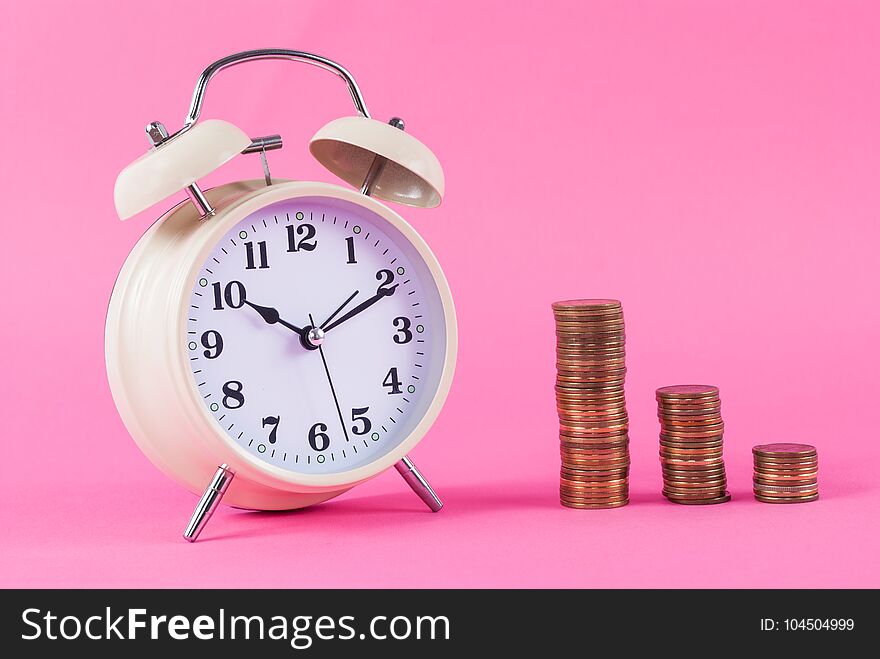 Old Clock And Golden Coins On Pink Background