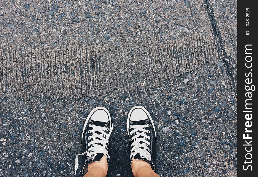 Person Wearing Pair of Black-and-white Converse All Star Low Sneakers