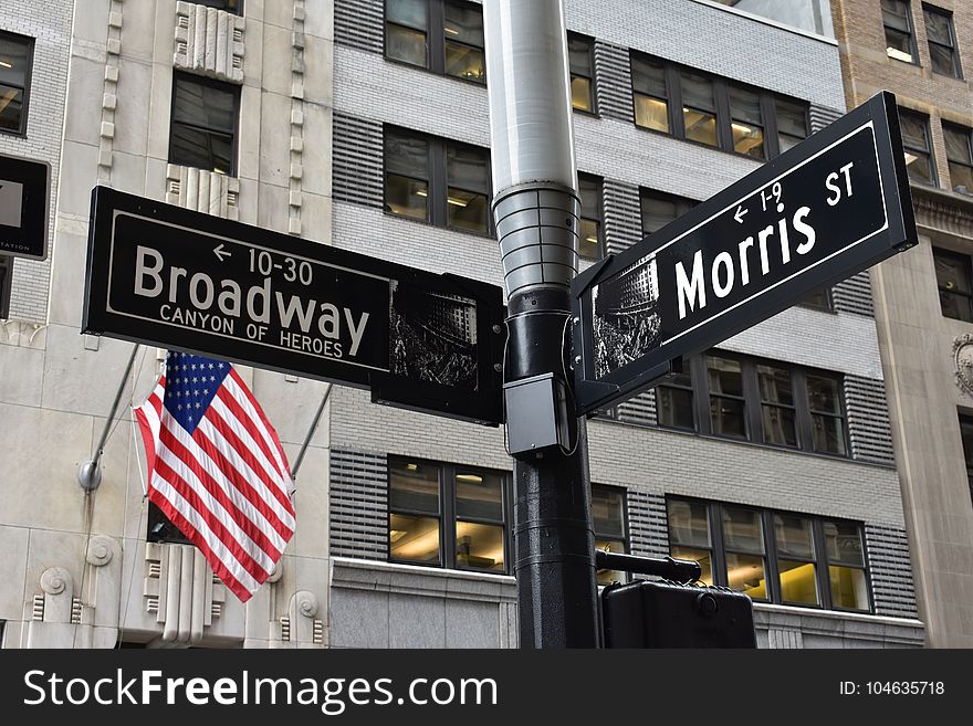 Grey and Black Broadway and Morris Street Signage Near U.s. Flag