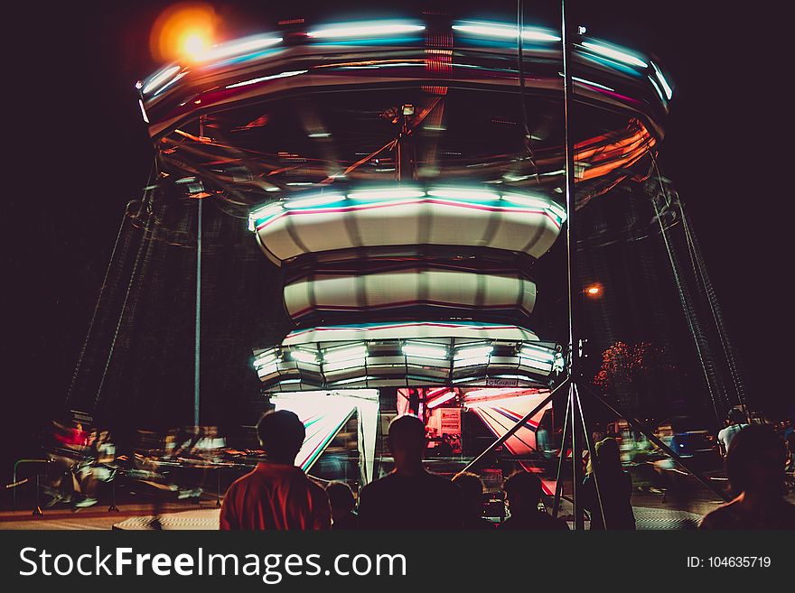Silhouette Photography of People in Front of a Circus Ride