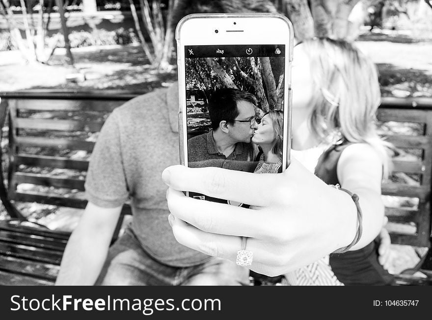 Gray Scale Photo of Man and Woman Taking a Selfie