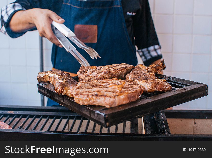 Cooked Meat On Black Metal Grill