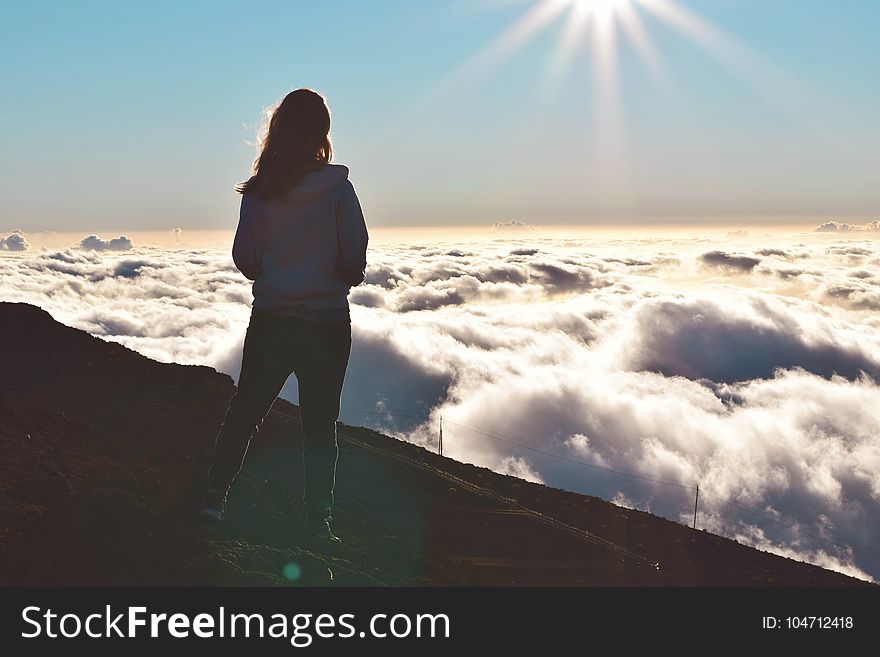 Woman Standing on Mountain