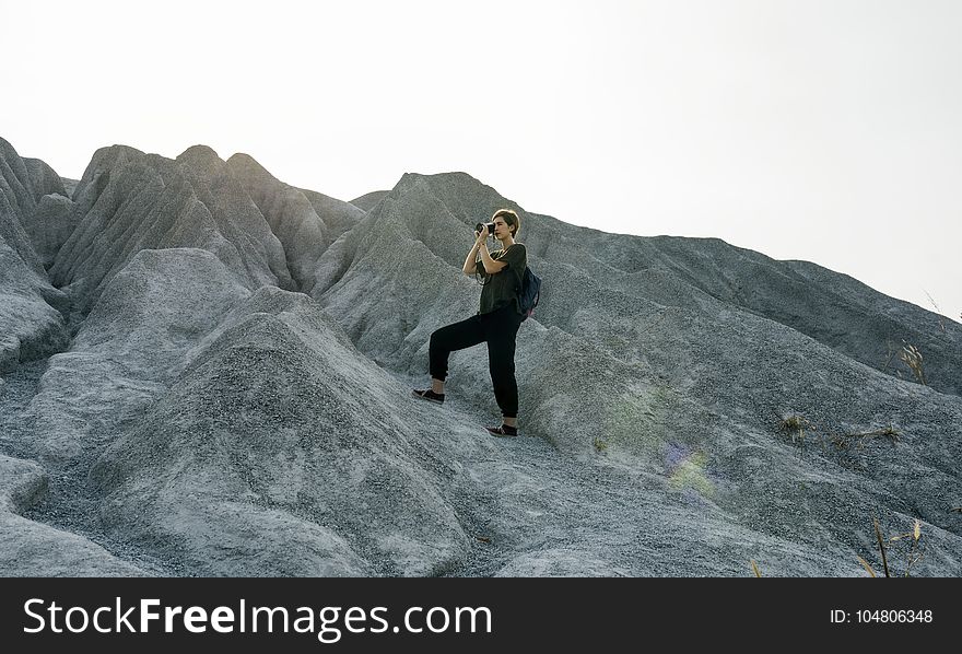 Woman Standing In Front Of Mountain