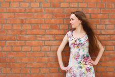 Girl Near The Brick Wall Stock Images