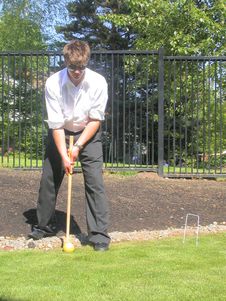 Jonny Plays Croquet Royalty Free Stock Images