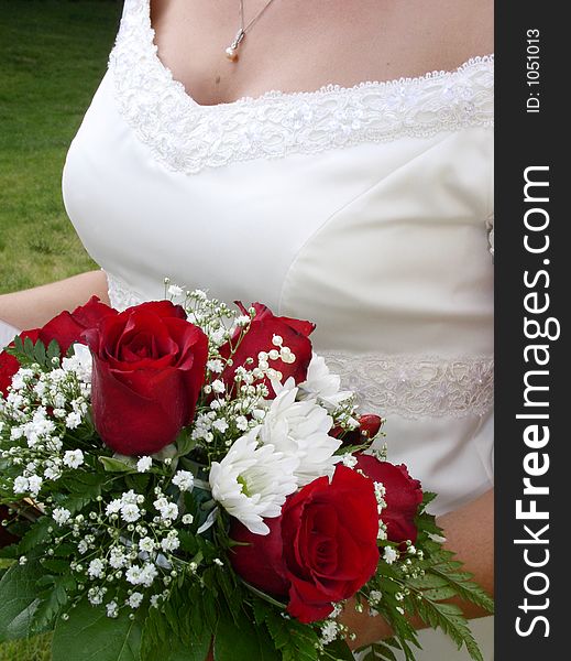 Wedding bouquet and bride s bust