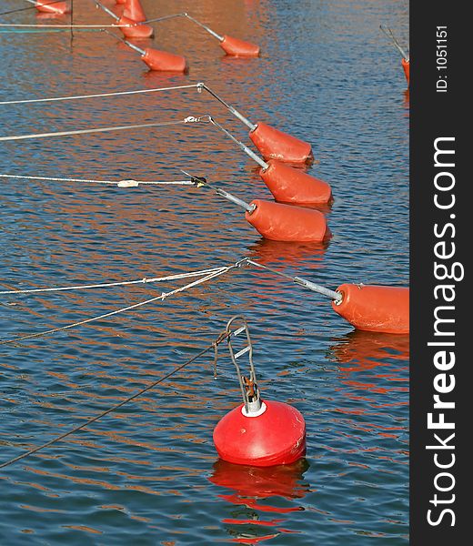 Yacht fixing buoys in a wharf before sunset
