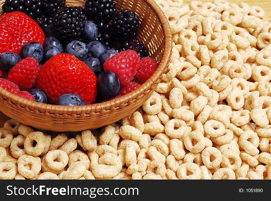 Bowl with forest fruits (blueberries,strawberries, blackberries) against cereals. Bowl with forest fruits (blueberries,strawberries, blackberries) against cereals.