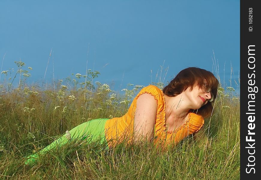 Girl reposes on grass. Girl reposes on grass
