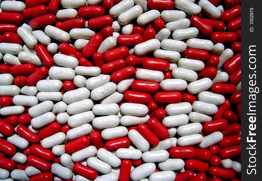 Cropped view of white and red pills.