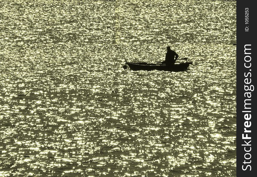 Fisherman on Lake Montbel, south west France. Fisherman on Lake Montbel, south west France