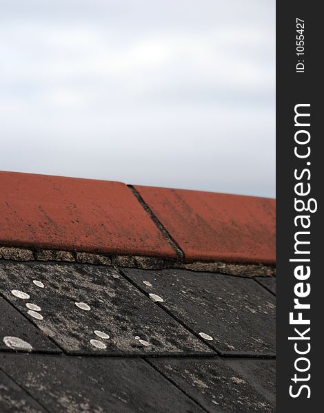 Closeup of slates on a roof and coping stone. Closeup of slates on a roof and coping stone