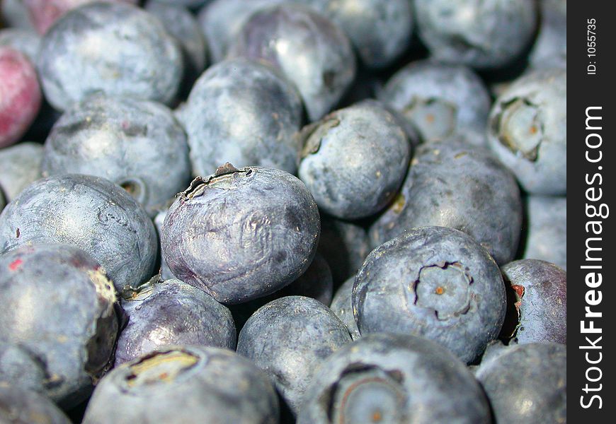 A close up shot of a bowl of ripe ready-to-eat blue berries