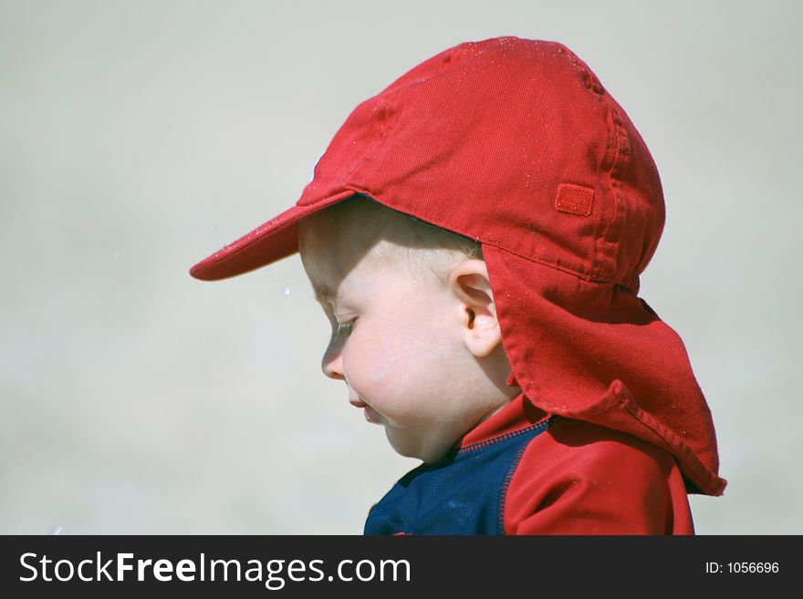 Small child exploring a beach in Cornwall. Small child exploring a beach in Cornwall.